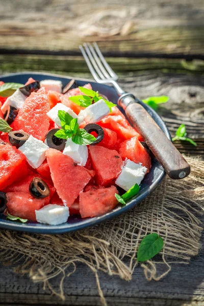 Juicy and fresh watermelon salad with blueberries and nuts. Watermelon salad with berries and nuts.