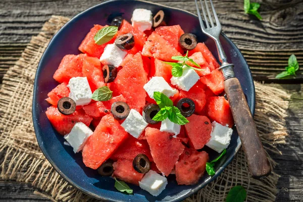 Tasty and sweet watermelon salad with blueberries and nuts. Summer watermelon salad with nuts and berries.