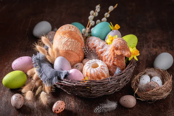 Stylish Easter basket is the most enduring Polish traditions. Easter background with easter eggs and catkins.