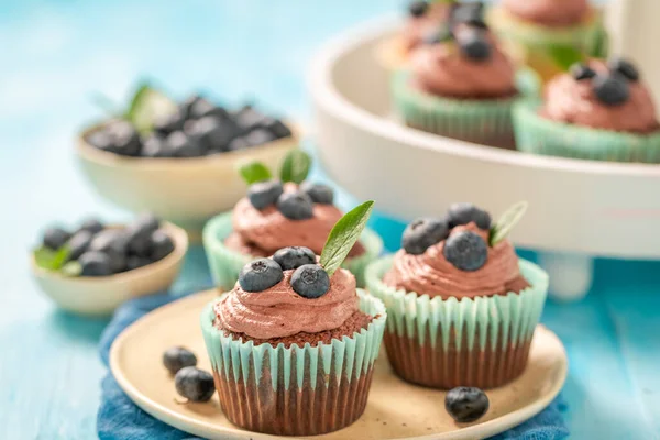 Tasty Sweet Cupcake Chocolate Cream Blueberries Chocolate Muffin Blue Table — Stock Photo, Image