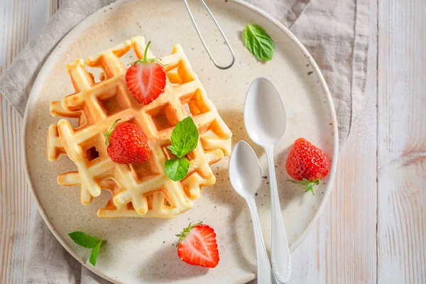 stock image Tasty and sweet wafers with powdered sugar and berries. Summer dessert with strawberries.