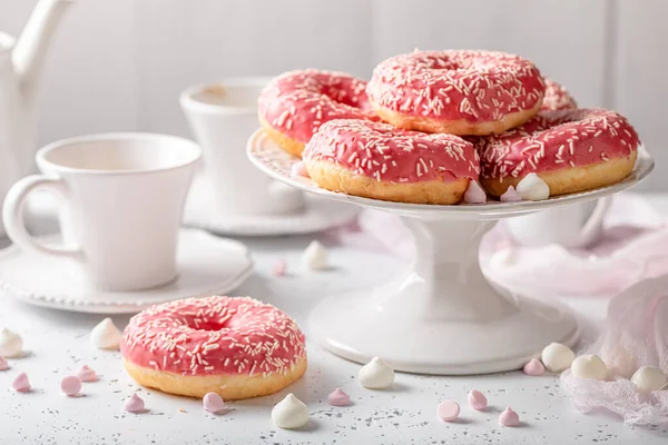 stock image Sweet and homemade pink donuts and coffee as perfect snack.. Donuts and coffee is best dessert ever.