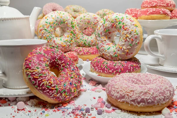Sweet and homemade pink donuts for Fat Thursday festive. Donuts is most popular dessert.