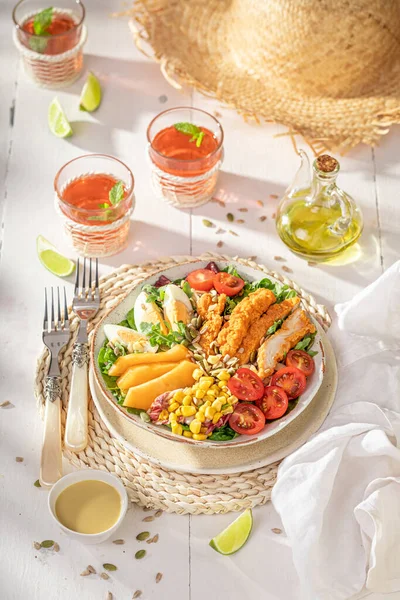 stock image Fresh salad served with mustard sauce and lemonade. Salad made of chicken, vegetables and fruits.