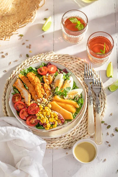 stock image Healthy salad with chicken, eggs, tomato and melon. Salad made of chicken, vegetables and fruits.