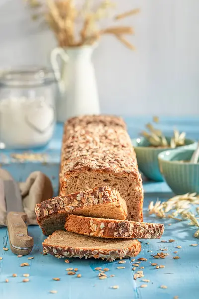 Healthy bran bread with grain, ears and bran.. Wholegrain bread with bran.