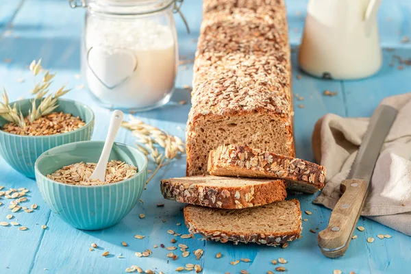 Delicious bran bread with seeds and ears of grains.. Wholegrain bread with bran.