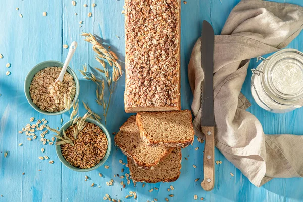 Fit bran bread with seeds and ears of grains.. Wholegrain bread with bran.