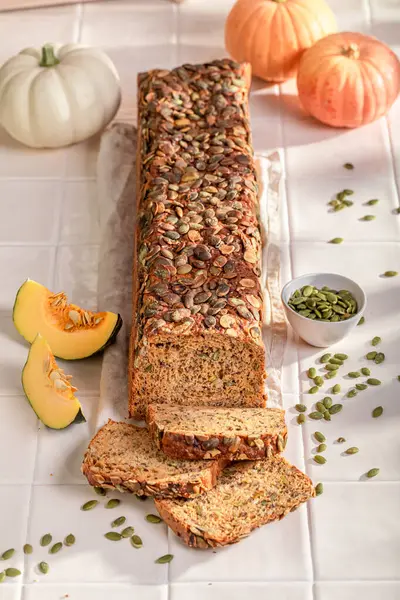 Fresh pumpkin bread baked with sesame seeds. Bread made of wheat, rye and pumpkin.