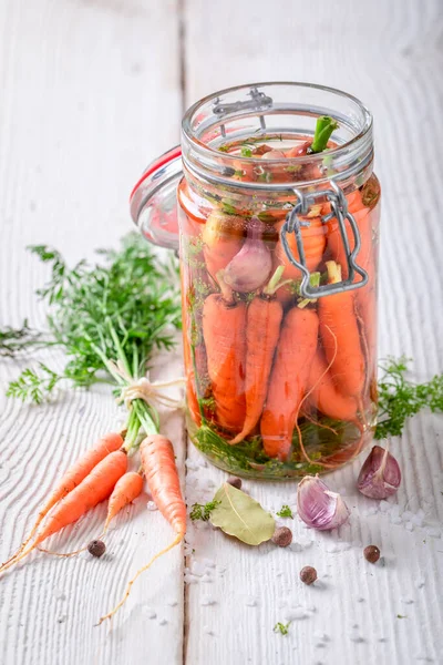 Homemade pickled carrots made of fresh vegetables.  Pickling carrots at home.