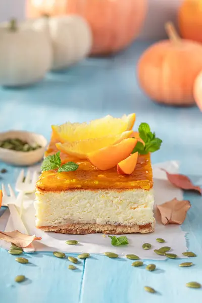Sweet pumpkin cheesecake made with oranges and kajmak. Pumpkin cheesecake for Halloween.