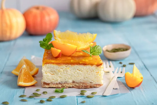 Tasty pumpkin cheesecake with caramel and oranges. Caramel cheesecake for Halloween.
