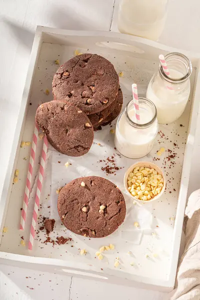 Delicious and sweet chocolate cookies with white chocolate chip. Chocolate butter cookies with milk.
