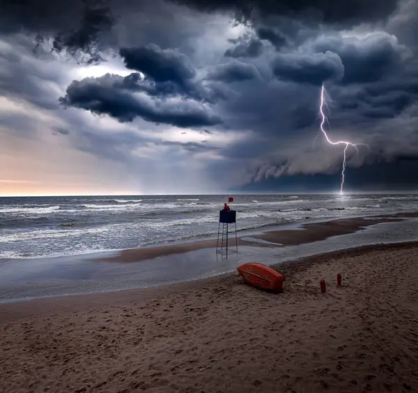 Lifeguard tower inundated by sea during lightning storm in Poland. Aerial view of Baltic sea after storm.
