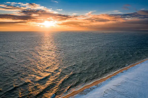 Stock image Baltic Sea and Hel peninsula in winter at sunrise. Aerial view of nature in Poland.