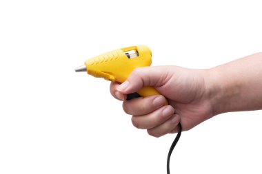 Küçük eklenti, yüzey katmanı ve diğer ürün montaj uygulamaları için kullanılan boş metin alanı olan sarı yapıştırıcı tabancaları, araç gereç birimleri ve şilteler.