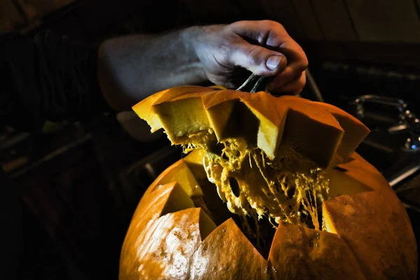 Top Being Lifted Halloween Pumpkin Being Carved Dark Kitchen — Stock Photo, Image