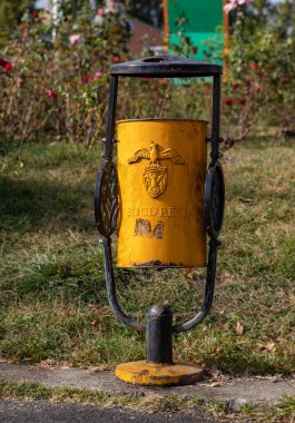 A picture of an ornate trash can in Bucharest.