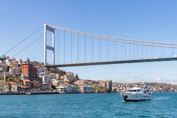 stock image A picture of the Fatih Sultan Mehmet Bridge and a yacht on the Bosphorus strait.