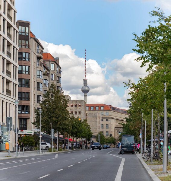 A picture of the Berliner Fernsehturm overlooking the Hannah Arendt Avenue, Berlin.