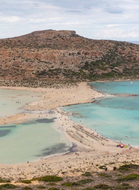 A picture of the blue water of Balos Beach and the nearby landscape of the Gramvousa Peninsula.