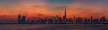 Gün batımında Dubai 'nin renkli bir manzarası ve Burj Halife' nin yükseldiği diğer gökdelenler..