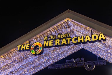 A picture of The One Ratchada night market sign at night. clipart
