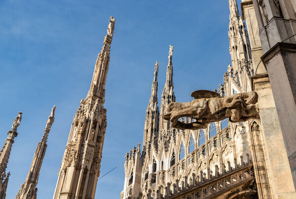 A picture of the Duomo di Milano or Milan Cathedral roof spires and statues.