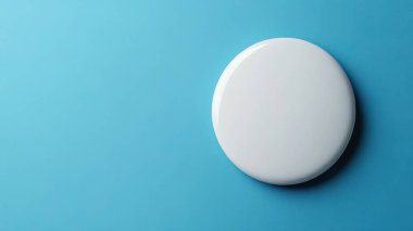 Canlı mavi arkaplan üzerindeki minimalist beyaz düğme, modern tasarım projeleri için mükemmel.