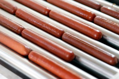 Grilling sausages on a electrical grill. Barbecue