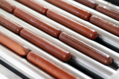 Grilling sausages on a electrical grill. Barbecue