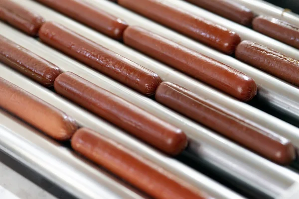 Grilling sausages on a electrical grill. Barbecue