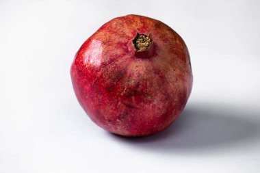 ripe pomegranate on a white background. selective focus. copy space.