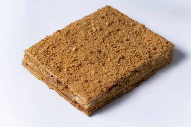 Honey cake on white background. Close up view