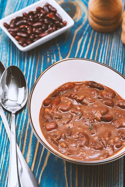 stock image Healthy bean soup with red beans, Homemade Soup on blue wooden background , Vegetarian Food.