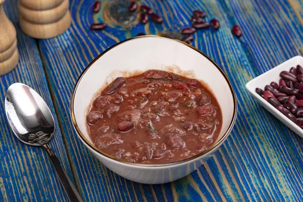 Vegetable soup with red beans, Homemade Soup on blue wooden background , Vegetarian Food