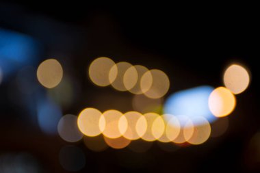 Şehir gece lambasının soyut dairesel bokeh arkaplanı, odaklanmamış