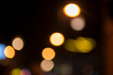 Şehir gece lambasının soyut dairesel bokeh arkaplanı, odaklanmamış