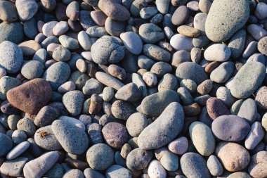 Sahilde çakıl taşları, arka plan olarak fotoğraf, dijital görüntü.