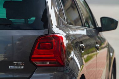  Side, Turkey -January 21, 2023:  Volkswagen Polo, close up detail on one of the LED red taillight modern blue car. Exterior detail automobile