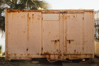 iron container with peeling paint for storage and transportation of goods