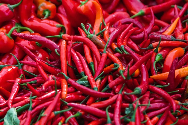 Close-up red vegetable for background, green pepper texture. Red chili peppers form a natural shape. Fresh raw vegetables