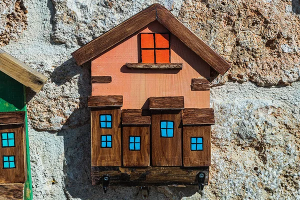 Close-up key keeper made of wood in the form of a house