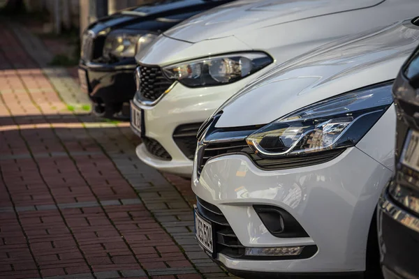 stock image Side, Turkey - February 05 , 2023:      white Renault Megane  , close-up of the headlight, bumper, wheel, on the street on a warm day 