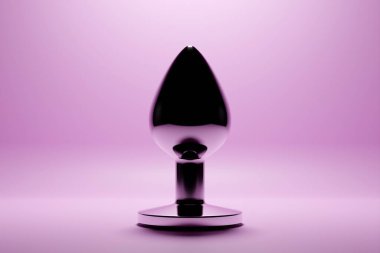 3D illustration.  Silver  butt anal plug sex toys on  pink  background. 