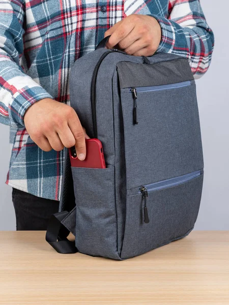 Man Plaid Shirt Takes Out Phone Stylish Backpack Work — Stock Photo, Image