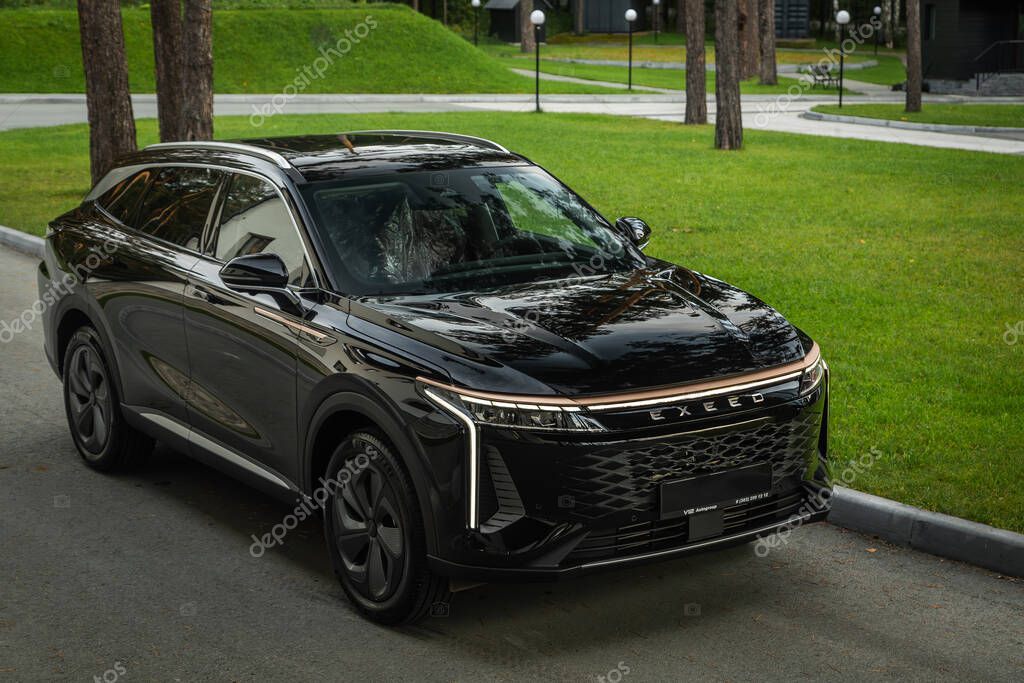 Novosibirsk, Russia - August 29 , 2023: black EXEED  RX  parked of a forest. No other car and people.