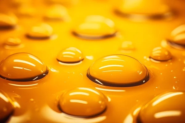 Close-up of yellow water drops, oil  on a monochrome  background, generated ai