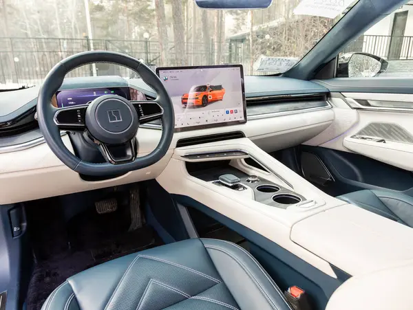 stock image Novosibirsk, Russia -  November 10  , 2023:  Zeekr 001, steering wheel, shift lever and dashboard, climate control, speedometer, display. Salon of a new stylish ca