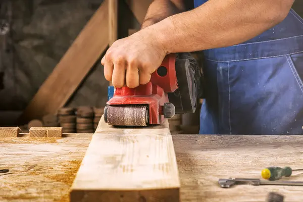 Close Young Man Builder Carpenter Equals Polishes Wooden Board Workshop — Stock Photo, Image